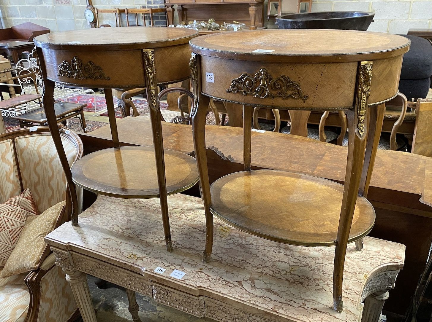 A pair of Louis XV style ormolu mounted banded walnut two tier side tables, width 54cm, depth 41cm, height 68cm